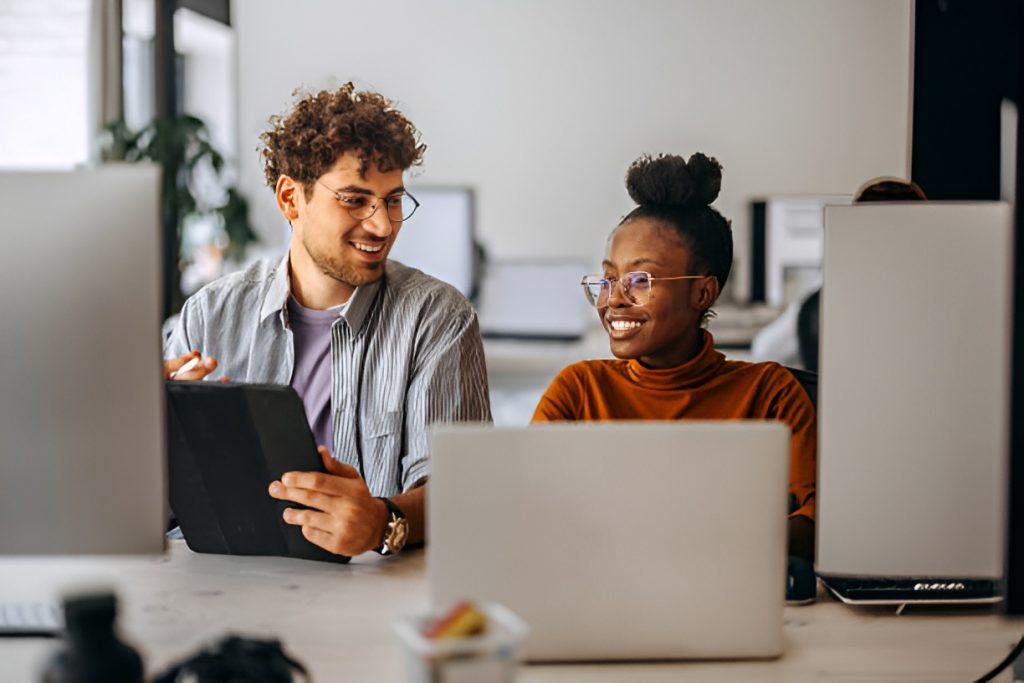 two office employees using computers